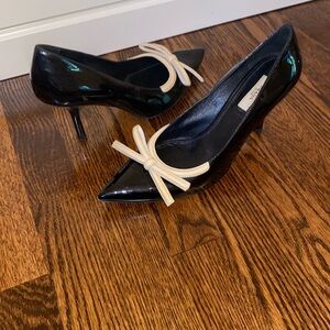 Prada patent leather pumps with demure bow detail